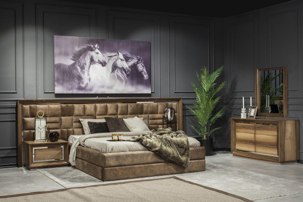 Роскошный набор для спальни с кроватью, прикроватными тумбочками и комодом.