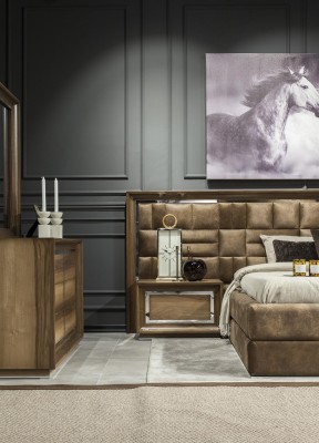 Роскошный набор для спальни с кроватью, прикроватными тумбочками и комодом.