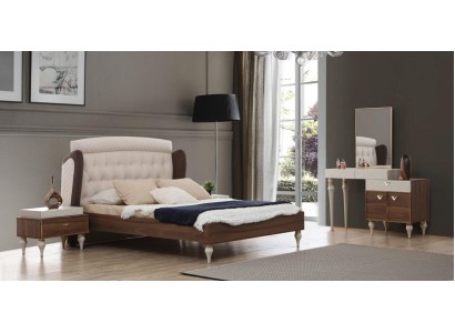 Полная спальня с кроватью, ночными столиками и туалетным столиком.